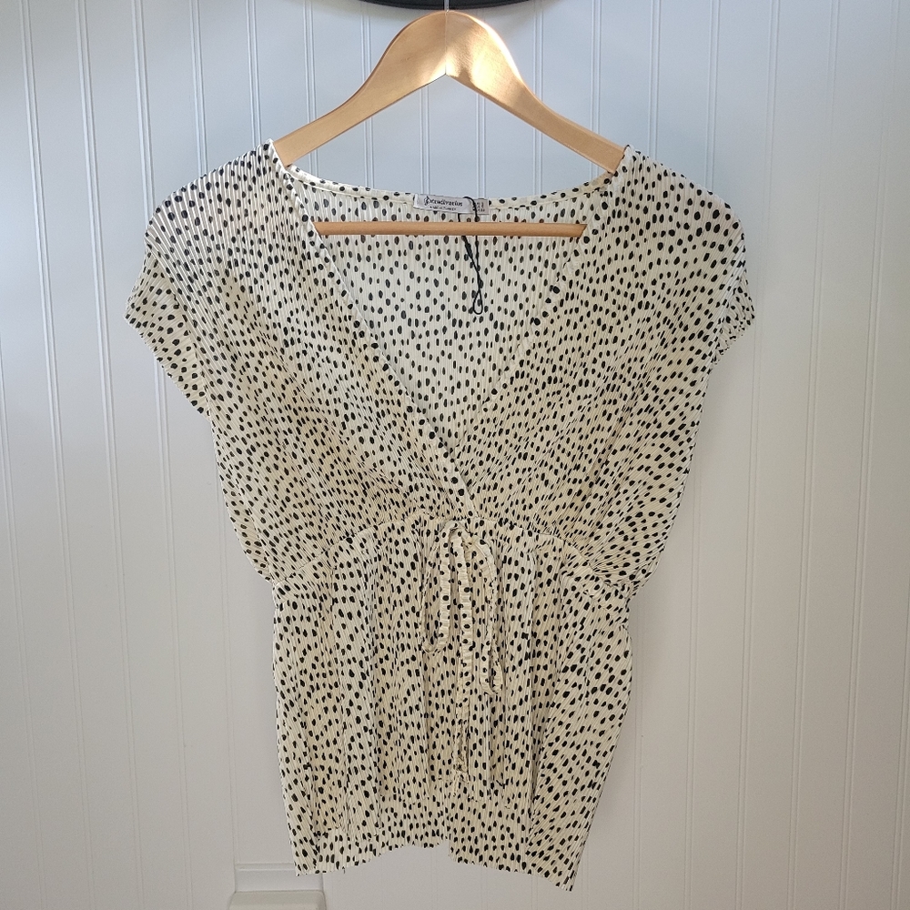 Black polka-dot blouse